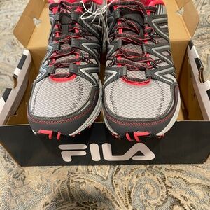 Brand new Fila mesh athletic shoes in size 9.5.  In box and never worn.